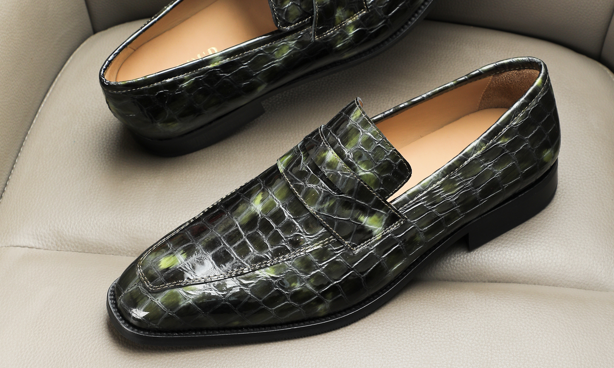 New arrivals at Dapper Shoes Co. — chisel toe penny loafers in Green Crocodile Embossed Patent