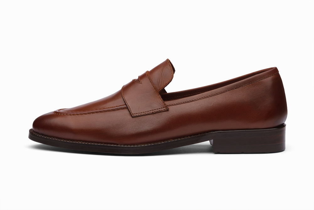 Brown unlined penny loafer — side profile — soft calfskin leather India