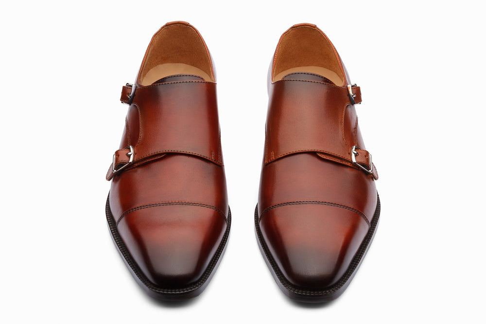 Cognac double monk strap shoes — side profile — handcrafted leather