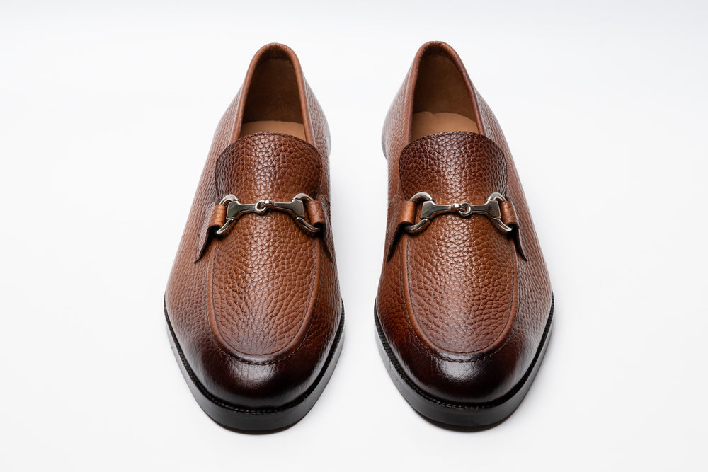 Tan horsebit loafers — side profile — milled grain leather India