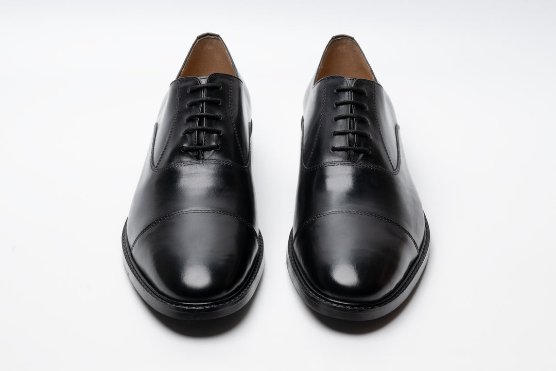 Black cap toe Oxford shoes — three-quarter view — handcrafted in Delhi