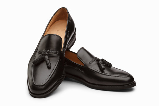 Black tassel loafers — three-quarter view — Dapper Shoes Co.