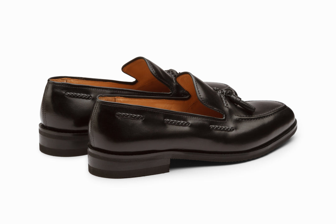 Black tassel loafers — sole view — handcrafted men&